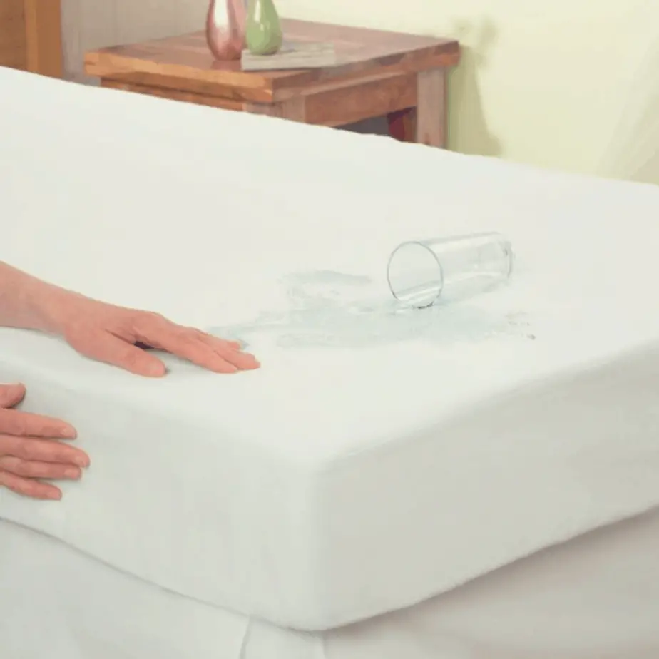 waterproof mattress protector with water poured on it