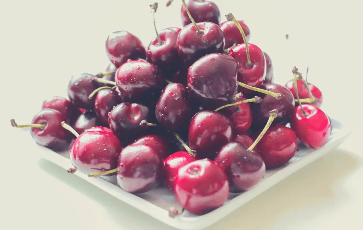 red cherries on a plate