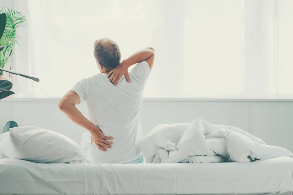 backache on a firm mattress