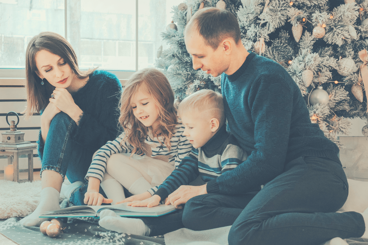 happy family going through a book together