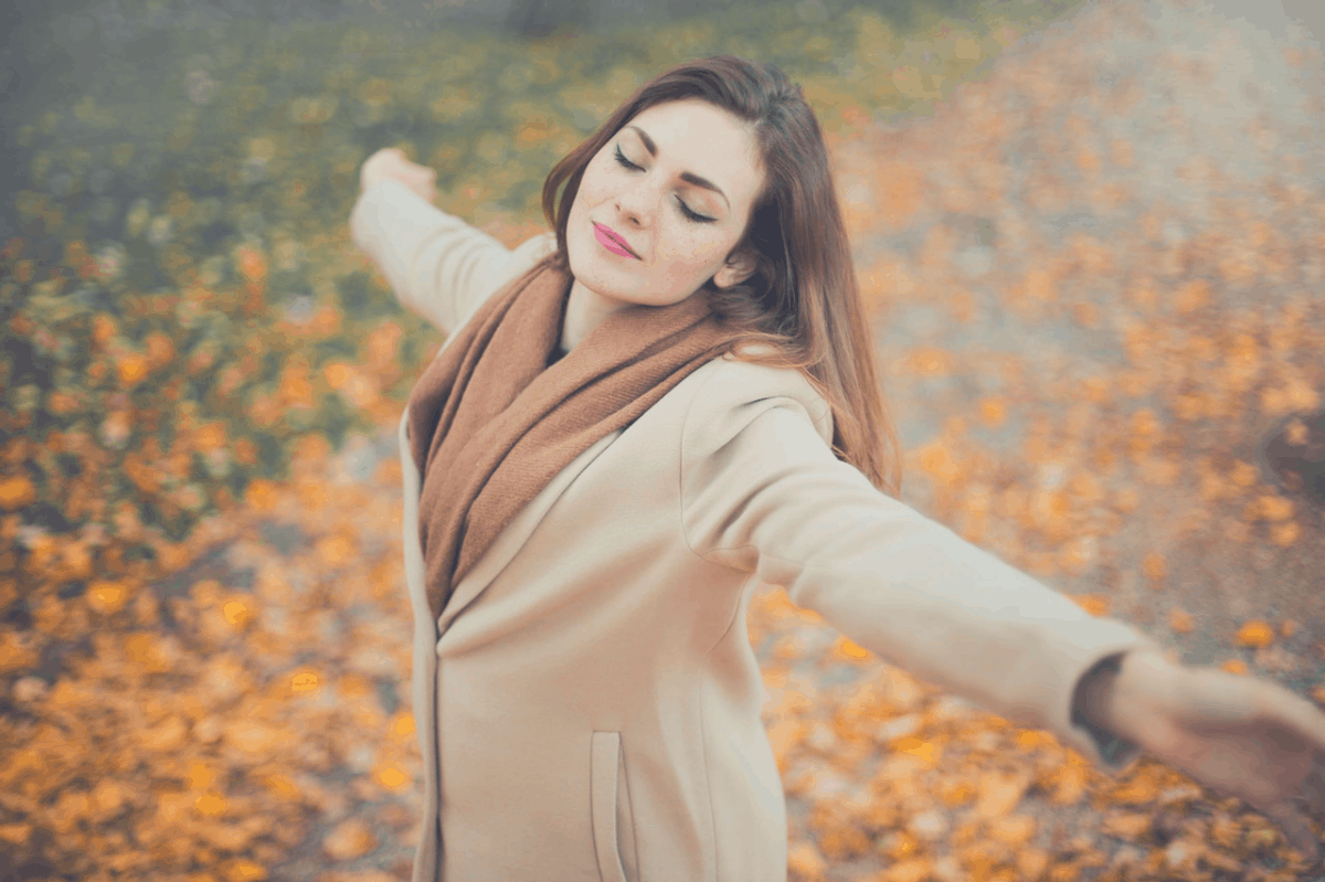 lady meditating while standing in the middle of a road