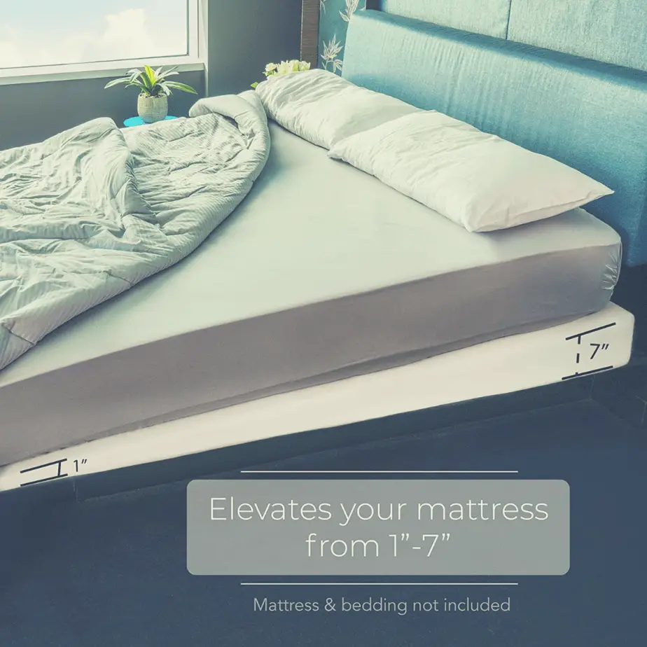 mattress elevator under a mattress on a headboard bed