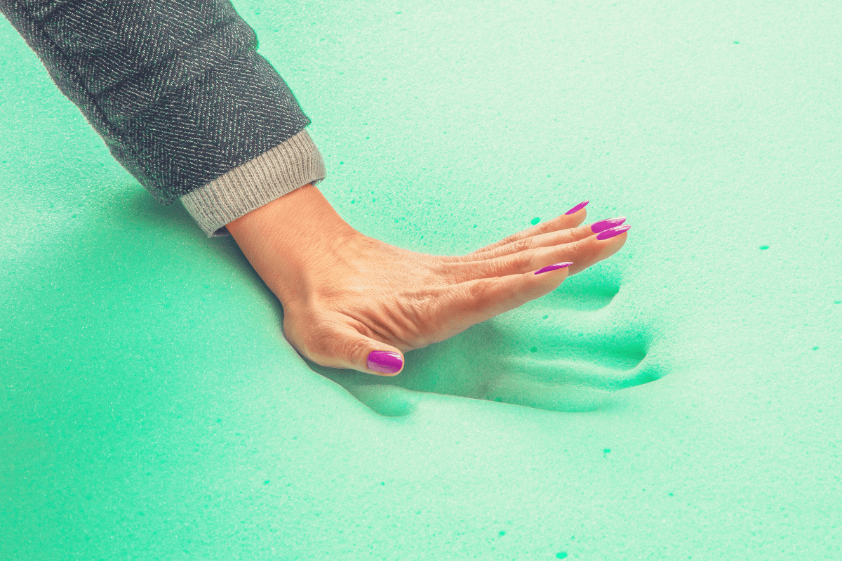 woman feeling the responsiveness of memory foam