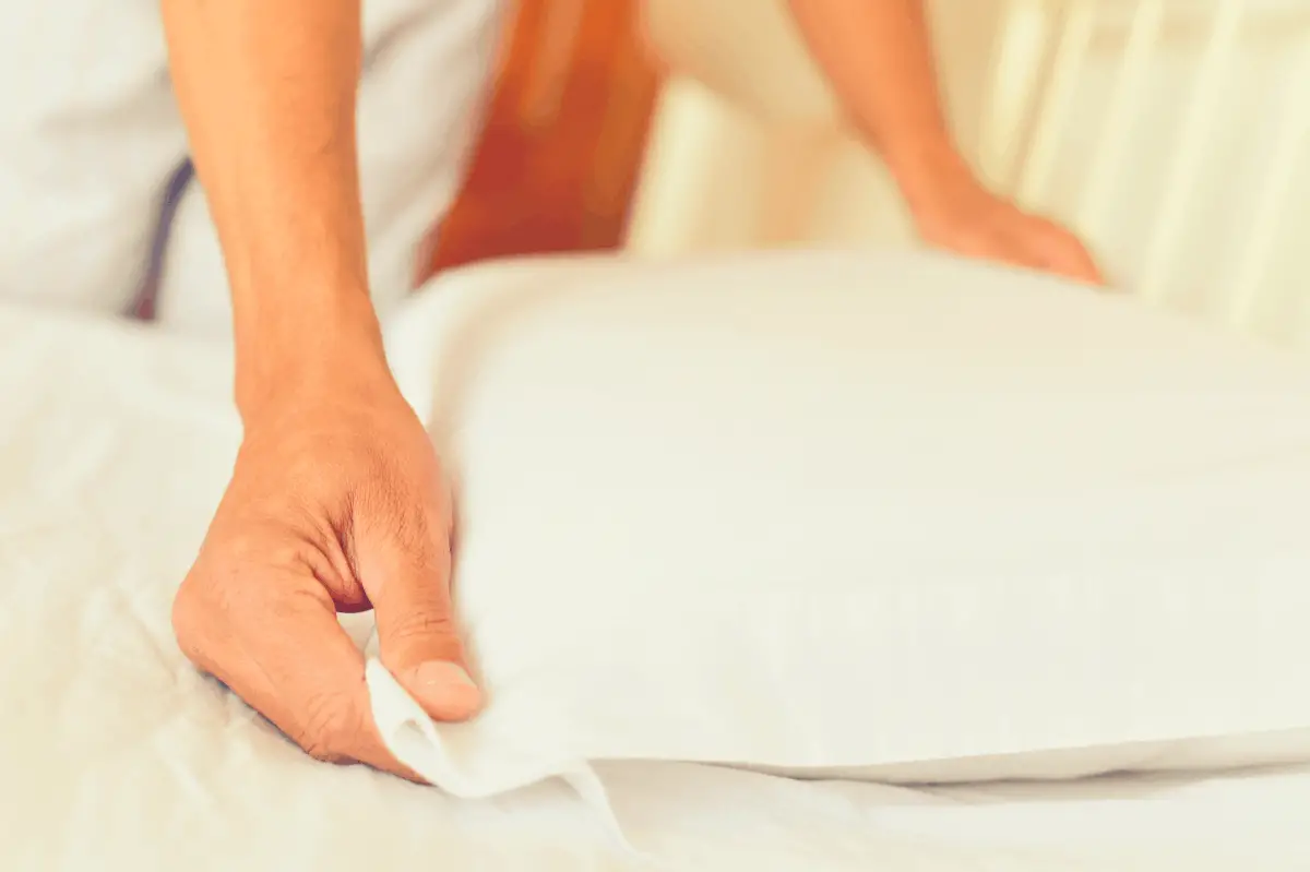 woman feeling her pillow case material