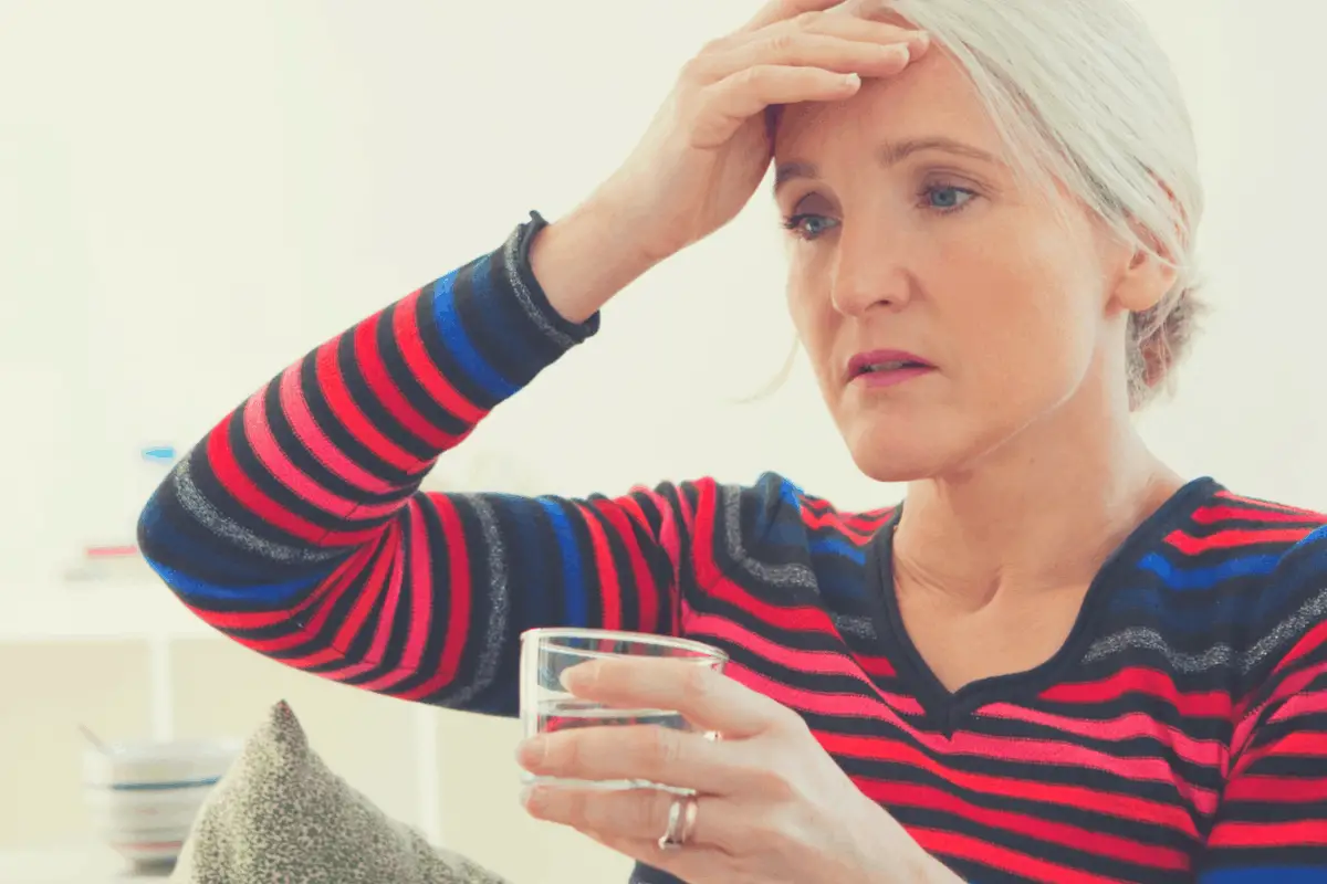 menopausal woman suffering hot flashes