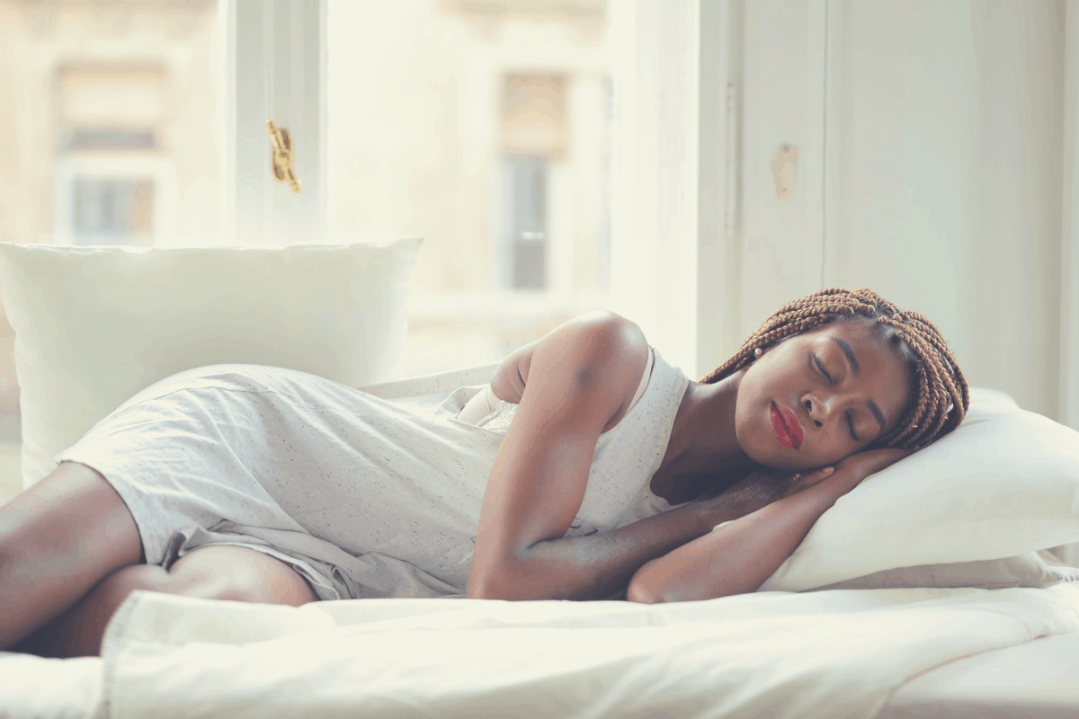 black woman sleeping during daytime