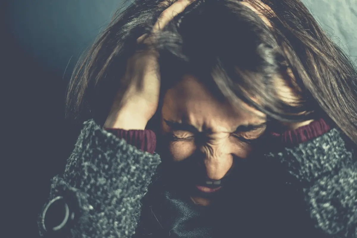 woman showing signs of stress