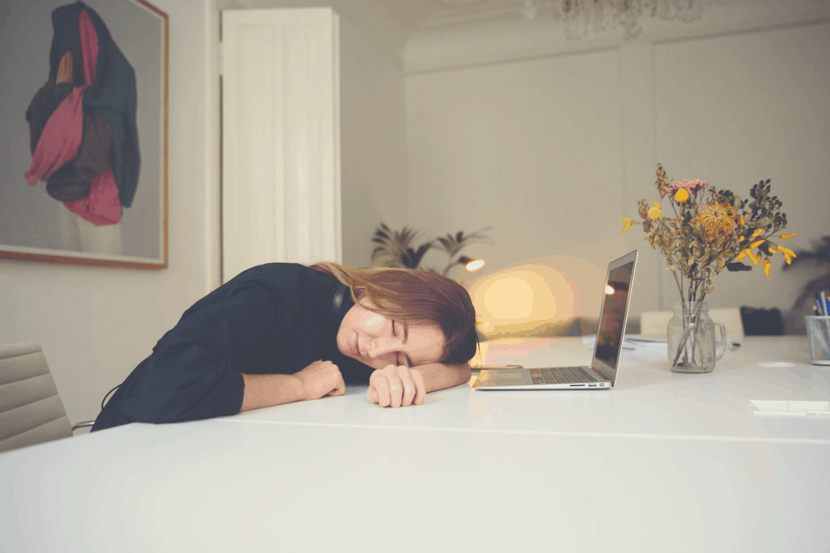 woman taking a nap on a table