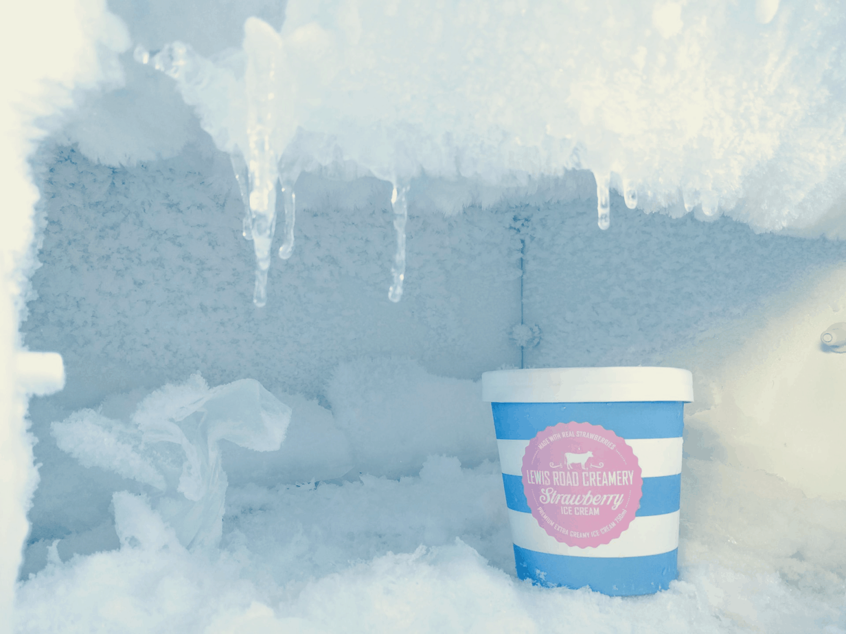 bucket of ice cream in a freezer