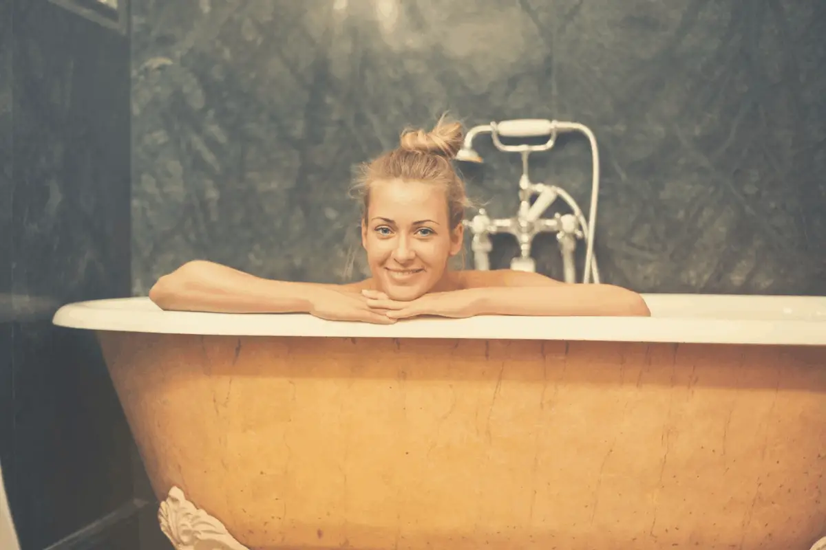 blonde woman taking a hot bath