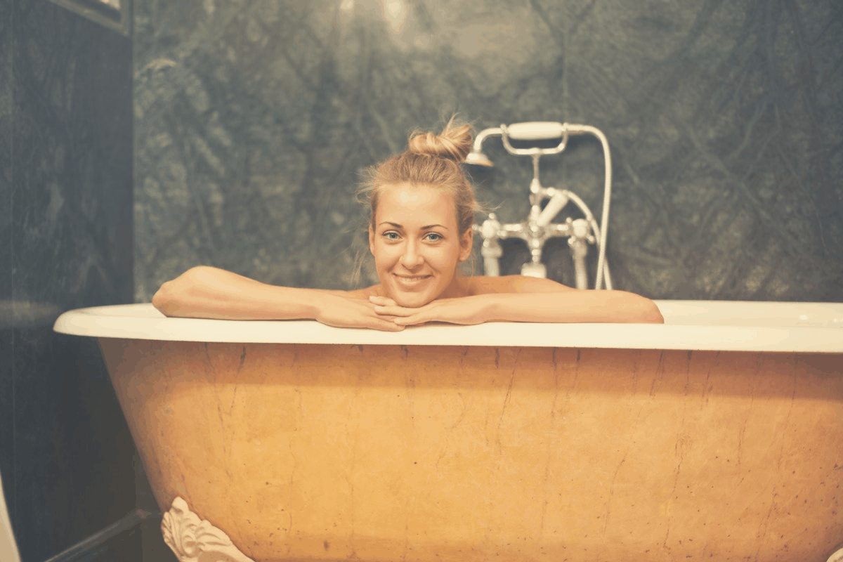 blonde woman taking a hot bath