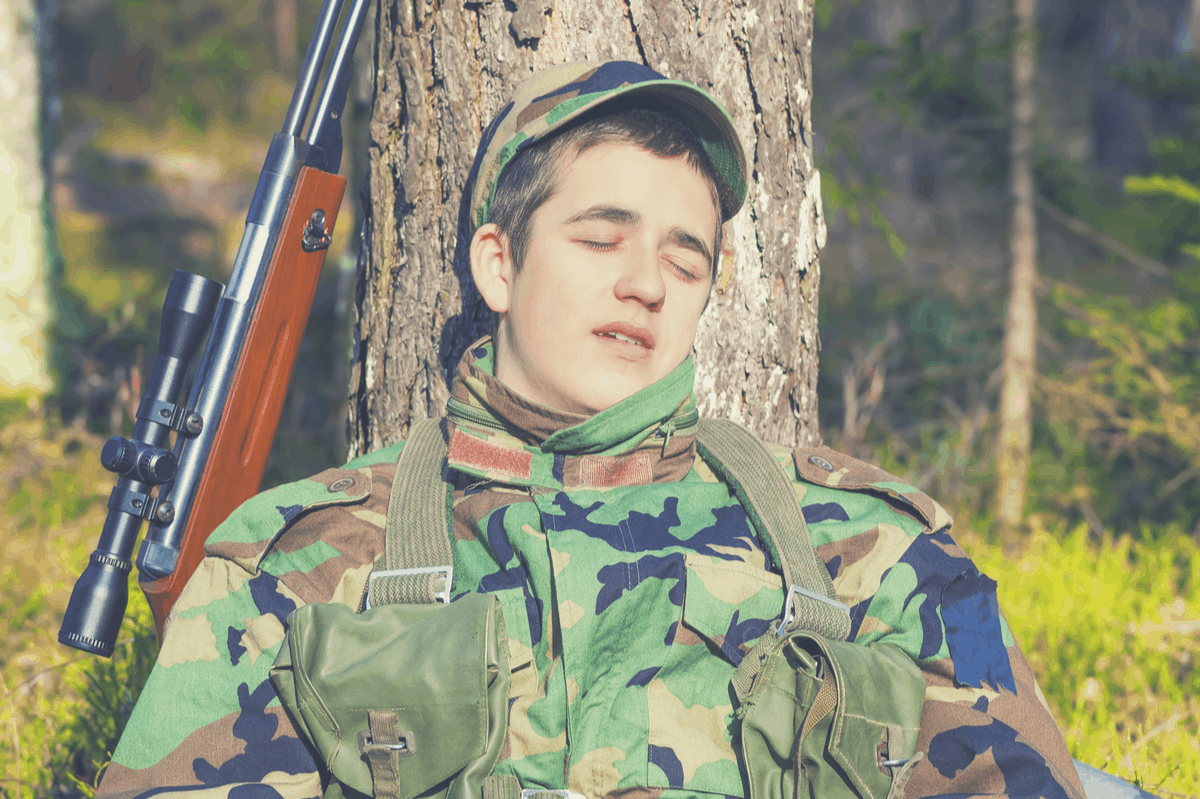 soldier sleeping in the bush