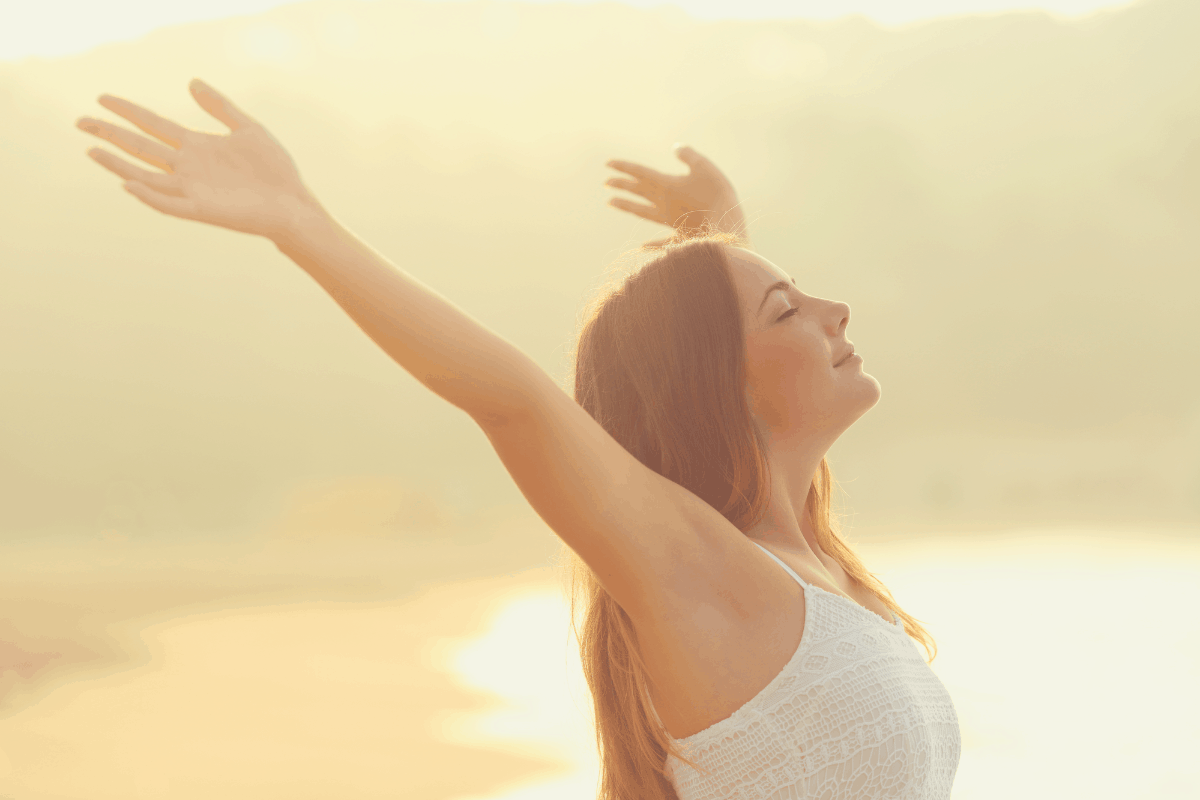 woman taking deep breaths outdoor