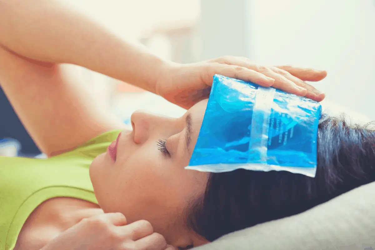 woman with ice pack on the head