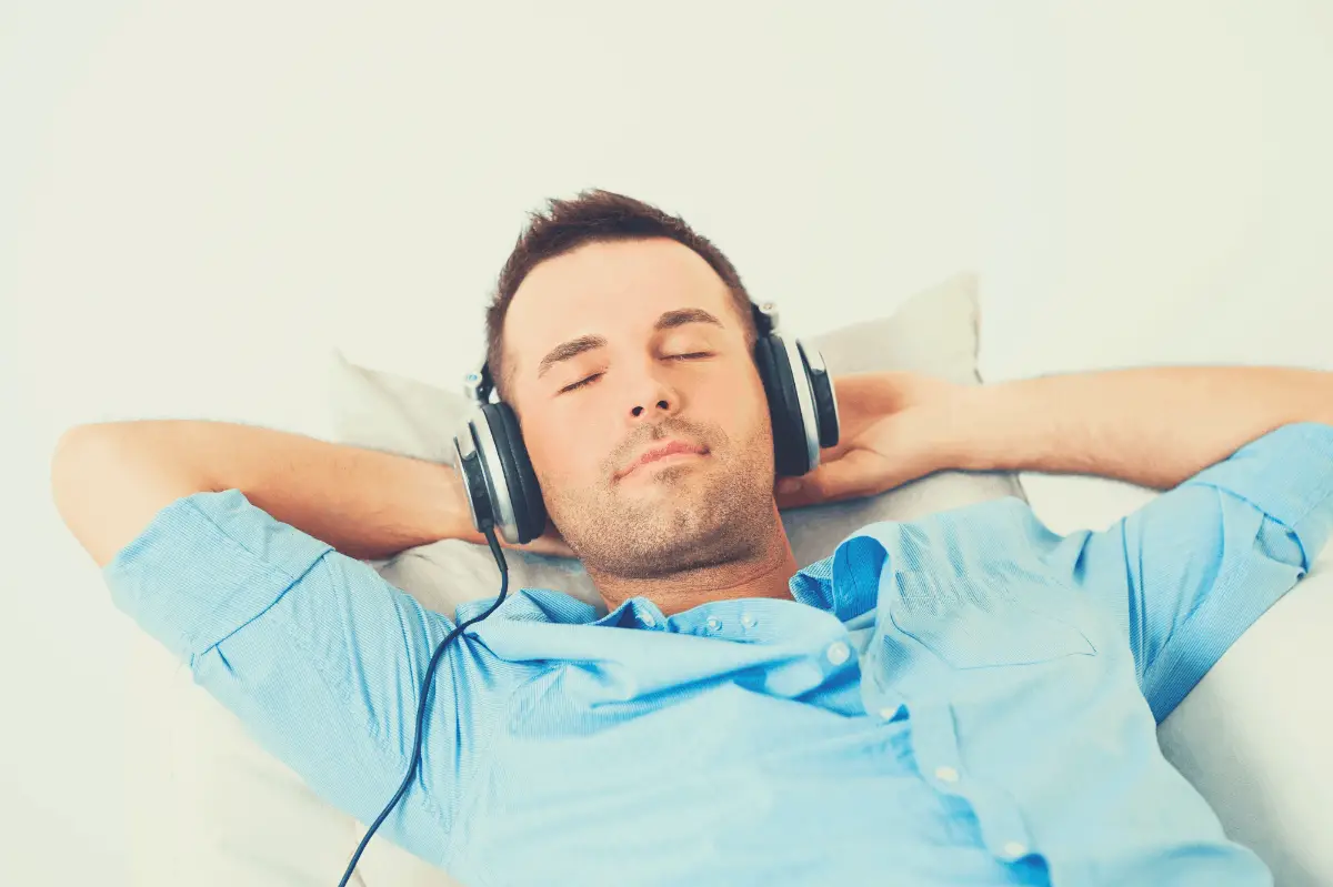 man sleeping with headphones on