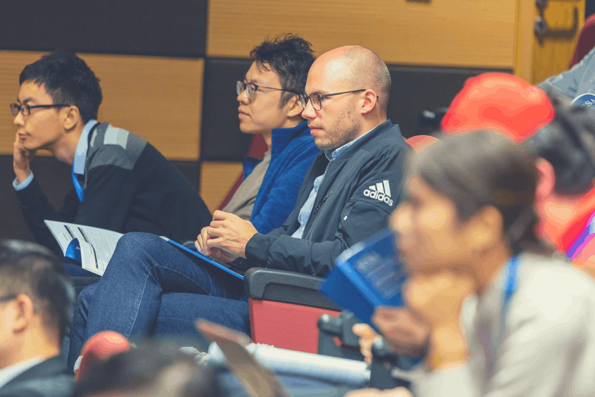 group of students paying attention in a lecture hall