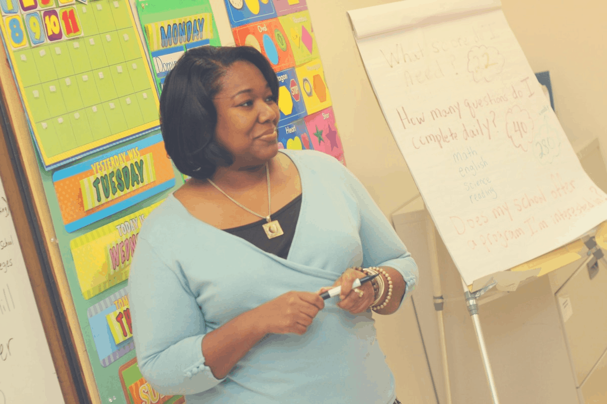 black woman standing in front of a class