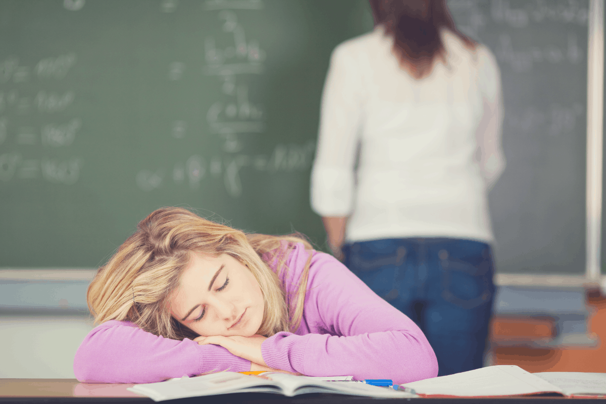 blonde girl sleeping in class