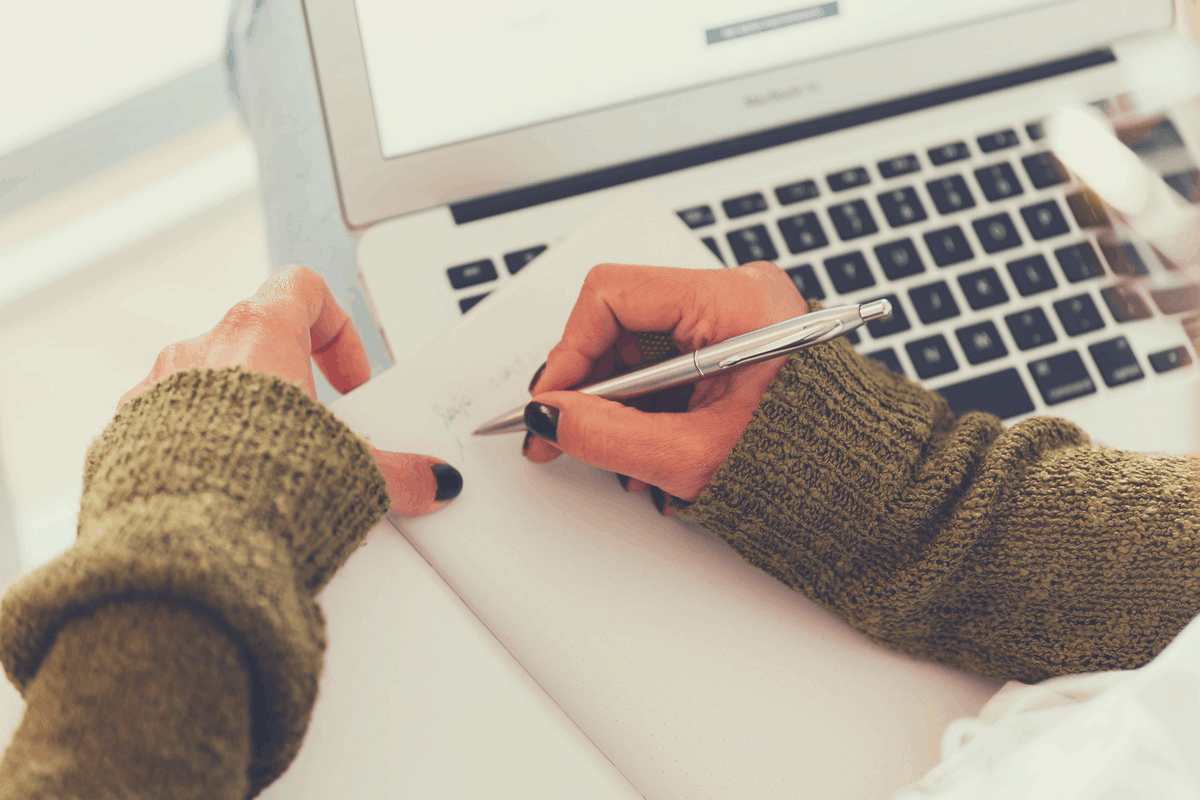 lady writing on a notepad