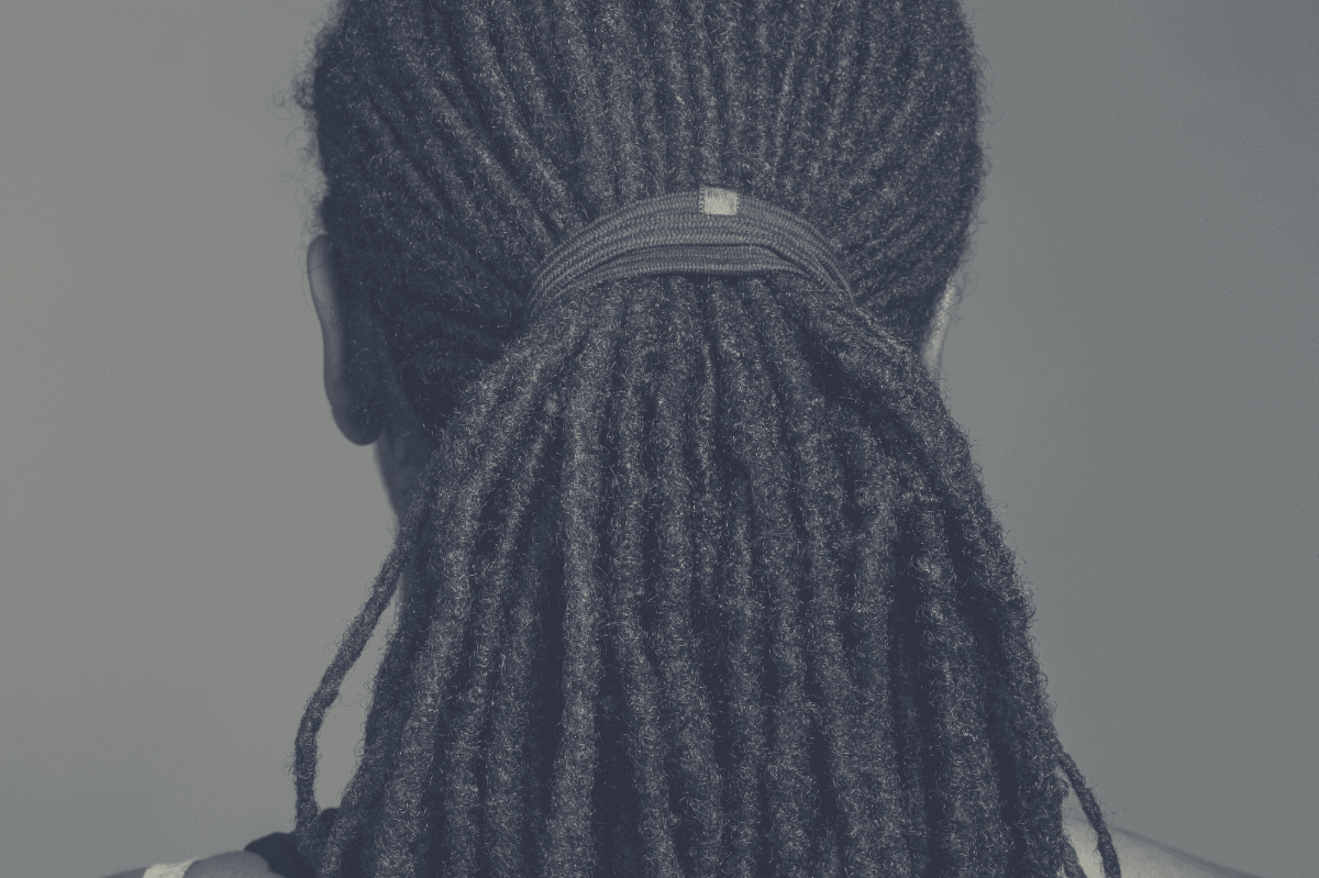 black man with tied up dreadlocks