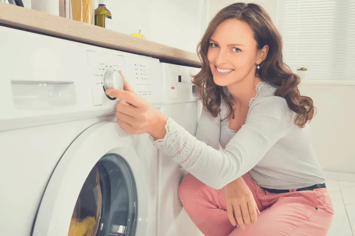 woman setting a washing machine