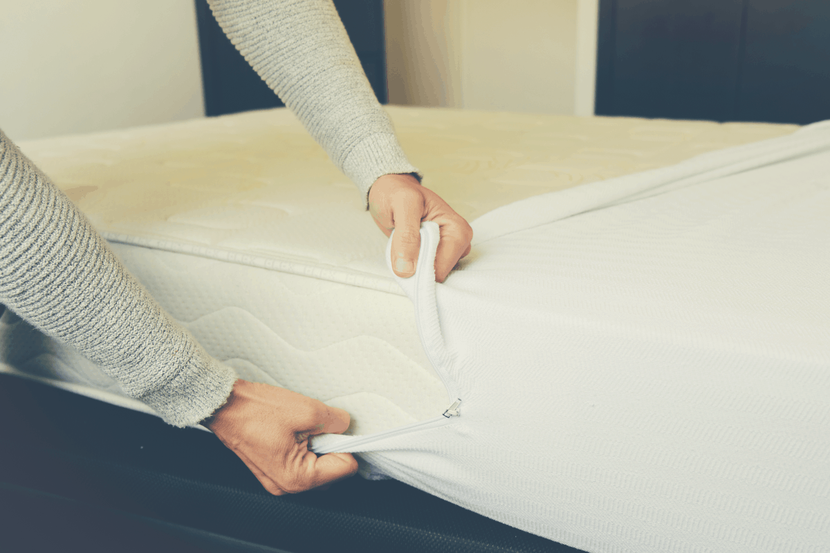 protector being wrapped on a mattress