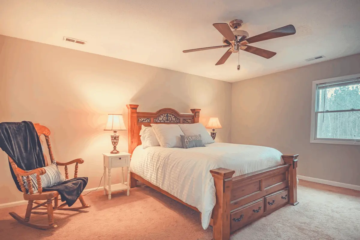 clean bedroom with ceiling fan