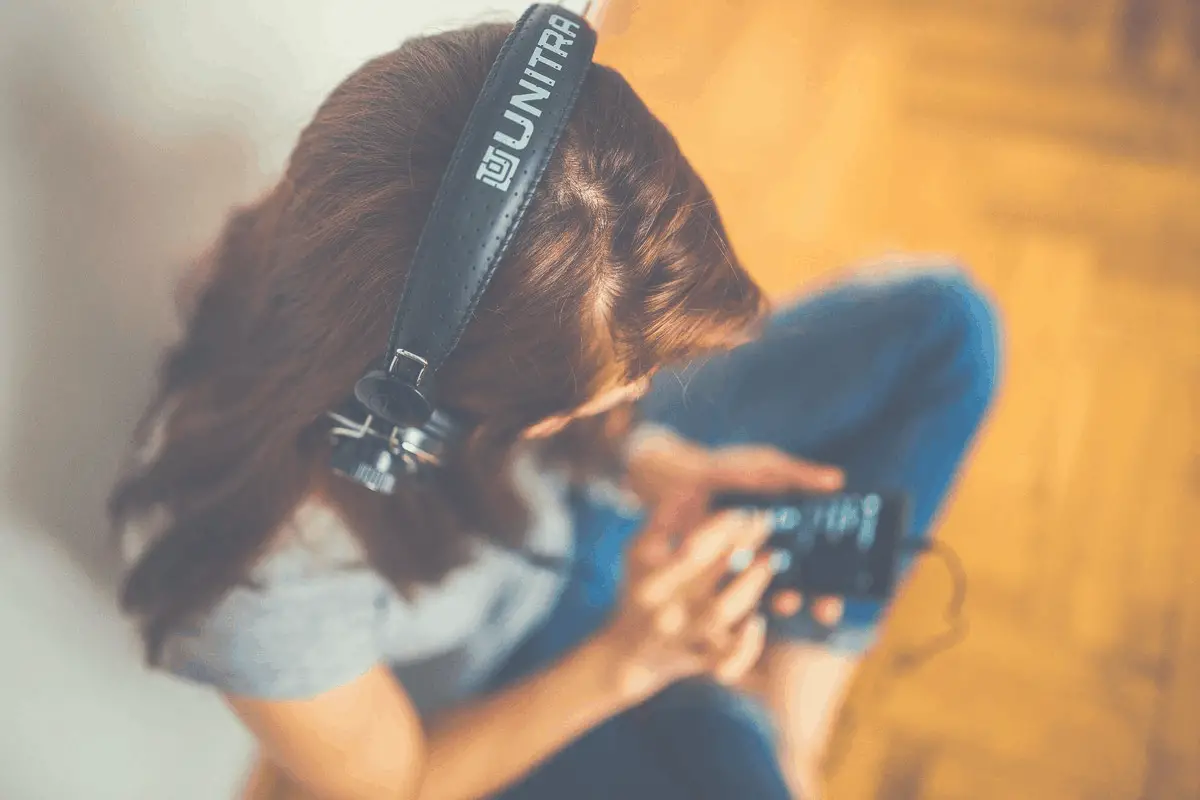 brunette listening to music with headphones