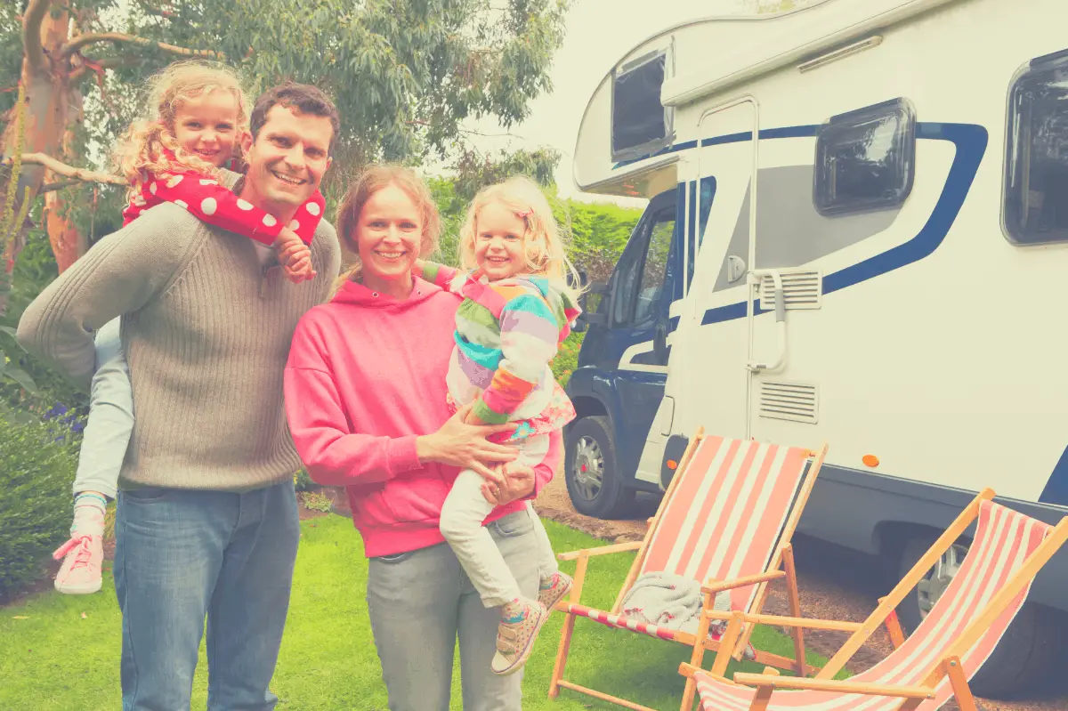 family standing in front of an RV
