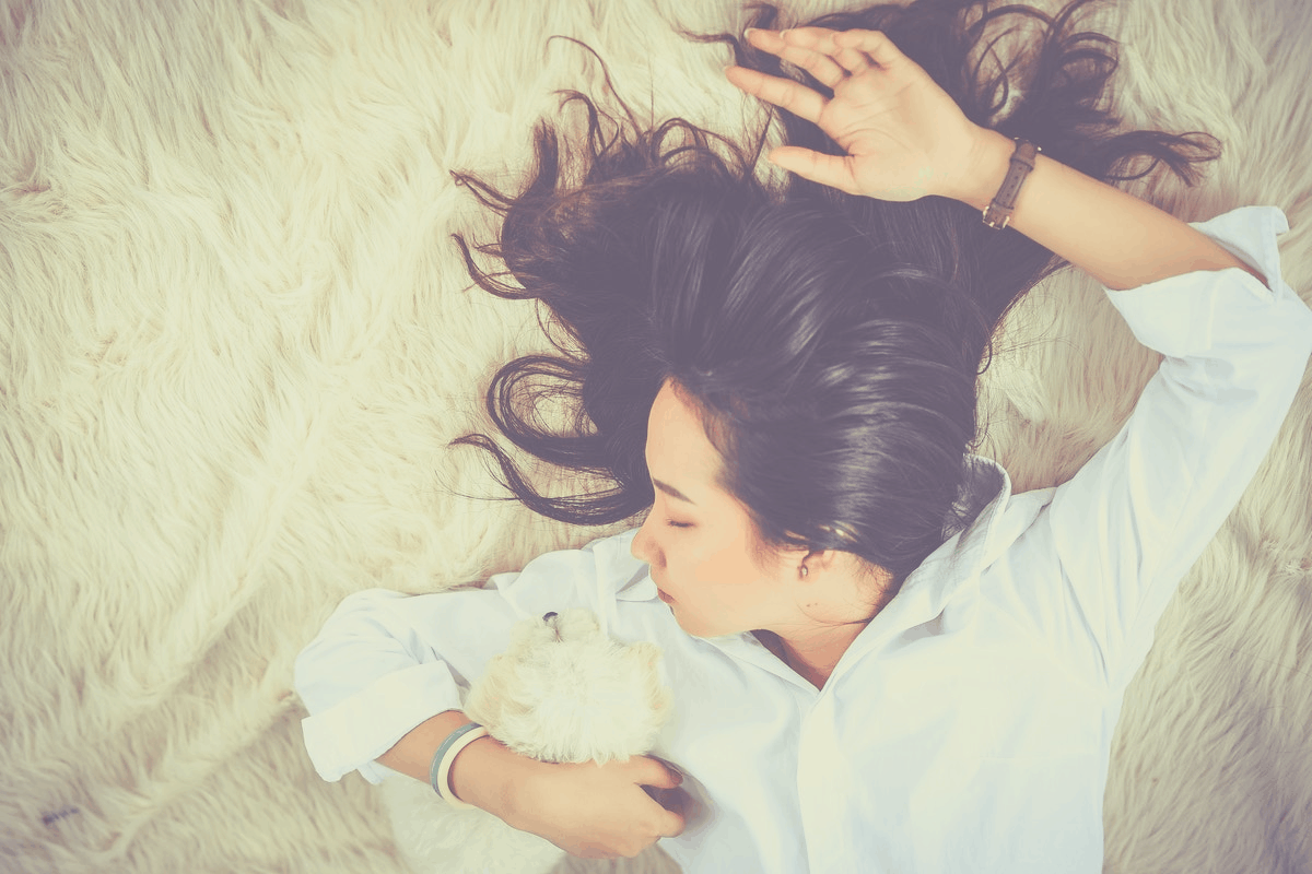 brunette relaxing with her dog