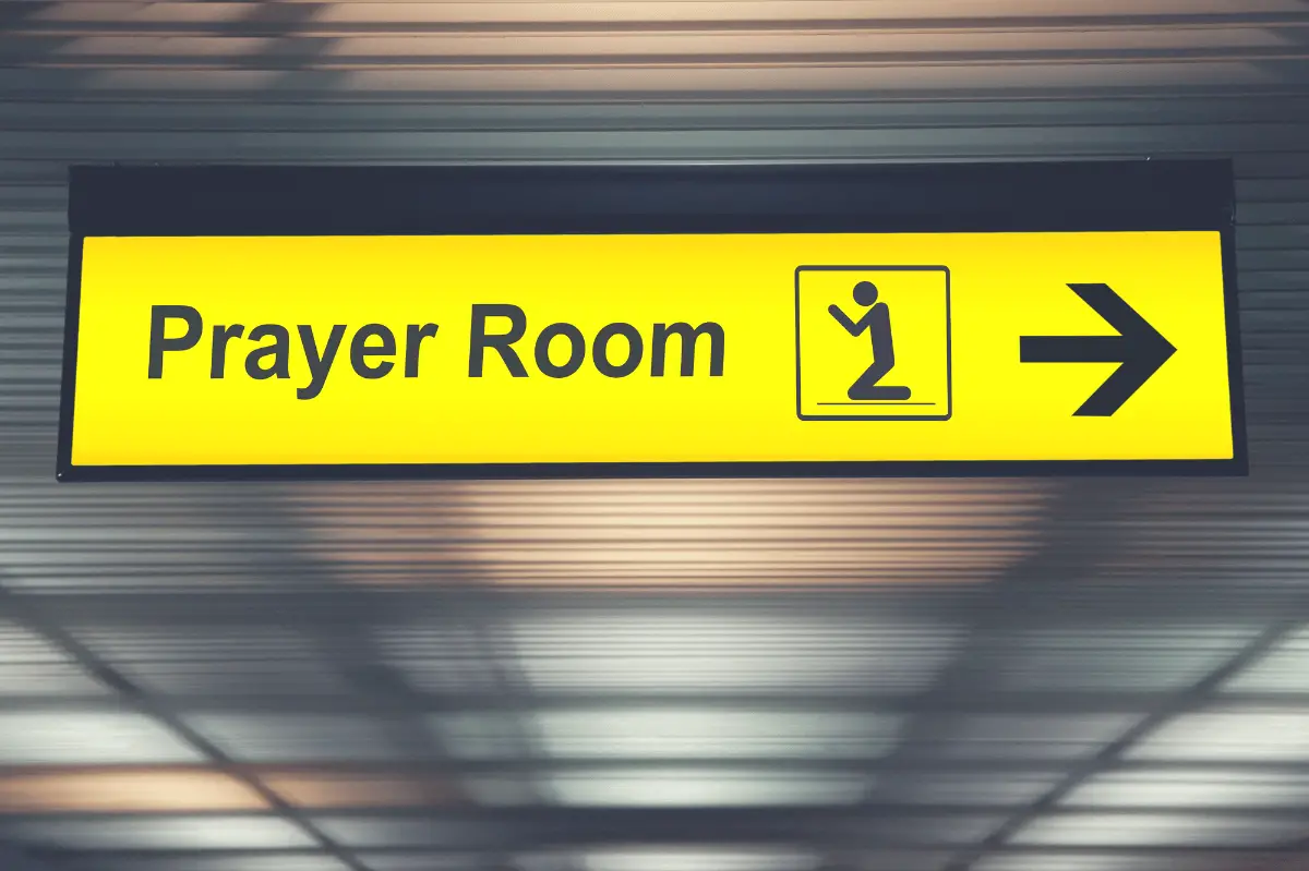 sign showing an airport prayer room