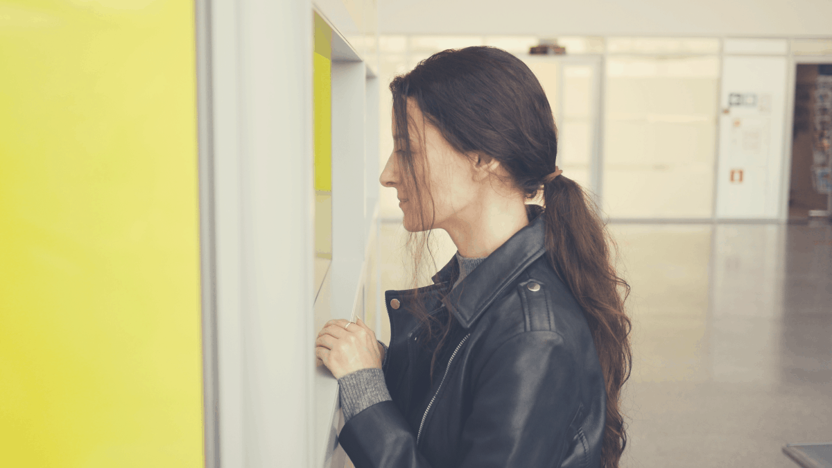 woman seeking help in an airport information desk