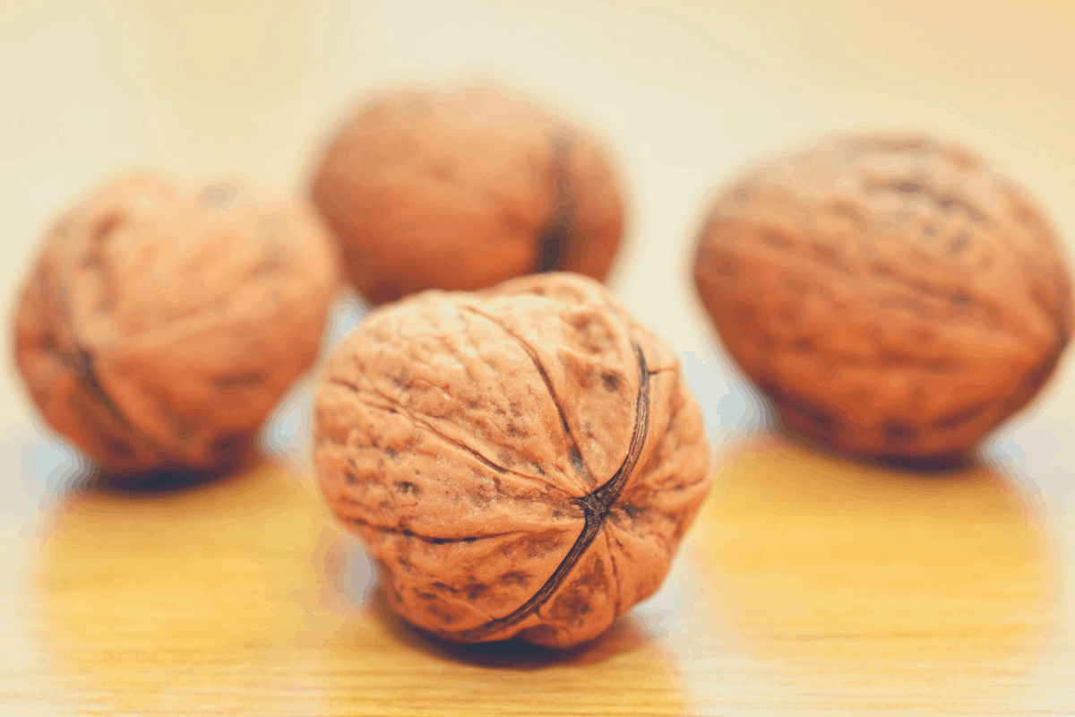 fresh walnuts on a chopping board