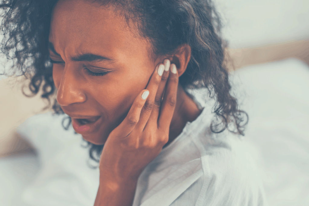 african american woman with ear pain