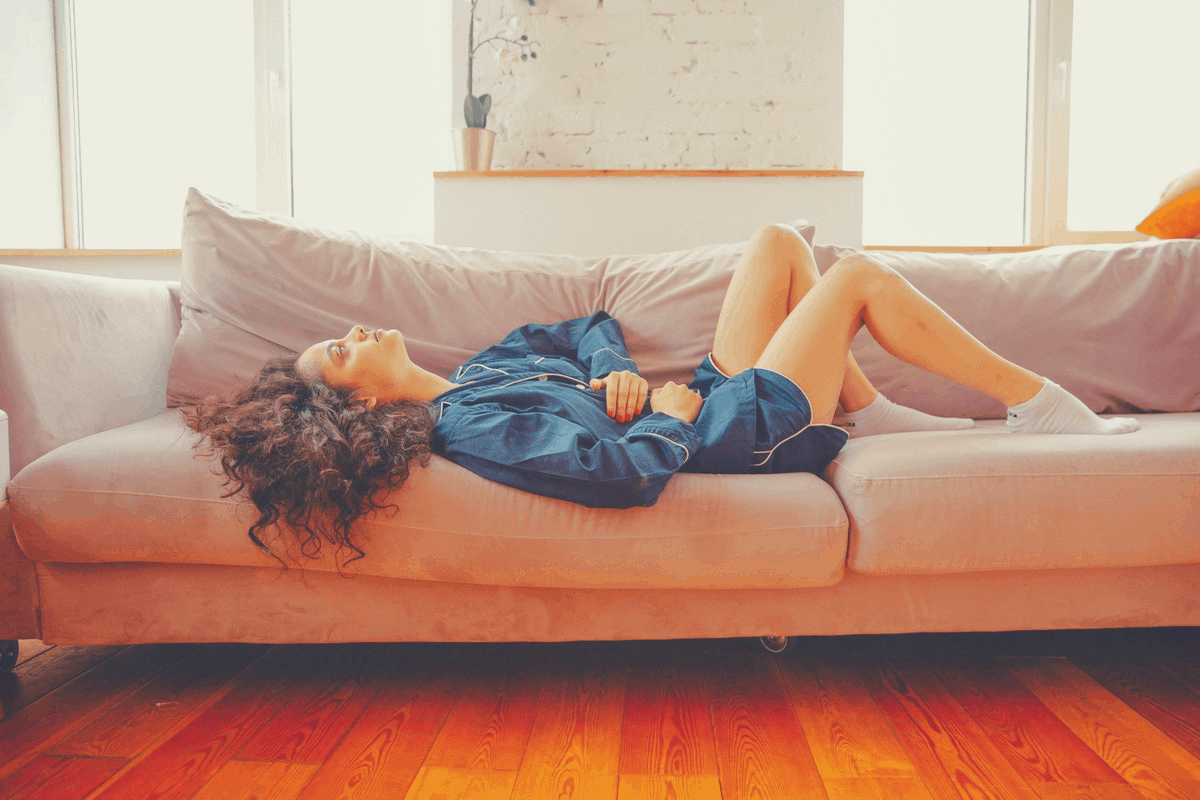 brunette lying down in a sofa