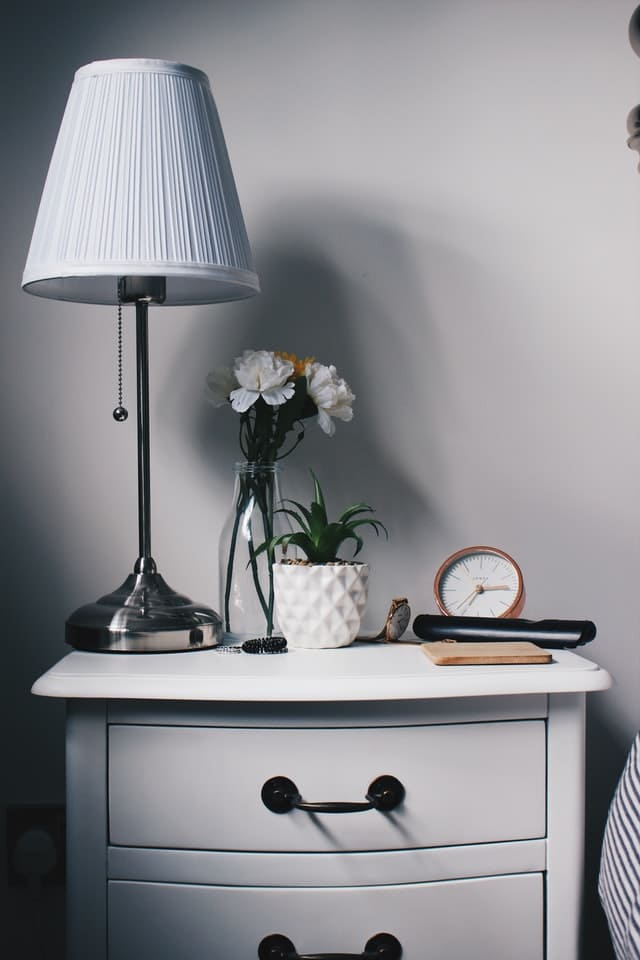 Bedside table with some items on